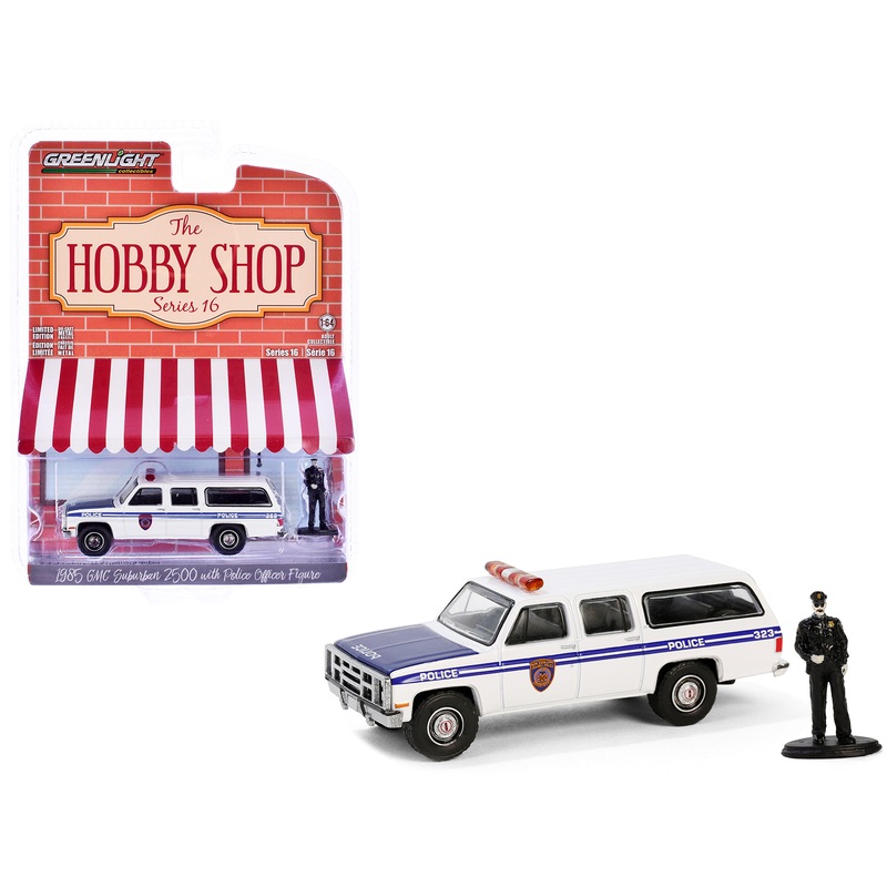 1985 GMC Suburban 2500 “New York City Transit Police Department” White with Blue Stripes and Police Officer Figure “The Hobby Shop” Series 16 1/64 Diecast Model Car by Greenlight